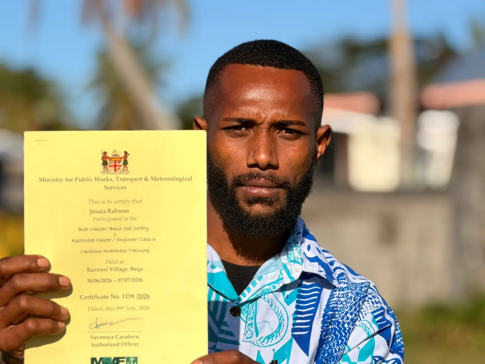 Josaia Rabuno with his certificate at Ekubu Village on Vatulele Island. 