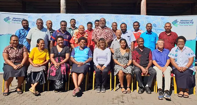 Laisiana Nayasi (front row, fourth from left) was part of the 13 aquaculture farmers who received bags of fish feed from the Minister for Fisheries, Semi Koroilavesau (second row, fourth from left) at the Port of Lautoka on July 20, 2020..  Photo: Nicolette Chambers