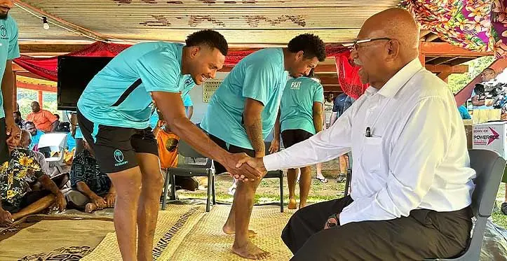 FIJI Water Flying Fijian squad reps Vilive Miramira (left) and Te Ahiwaru Cirikidaveta meet Prime Minister Sitiveni Rabuka in Welagi, Taveuni, on July 6, 2023. Photo: FRU
