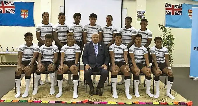 Prime Minister Voreqe Bainimarama presented the Fijiana 7s team jersey at Pacific Theological college on August 31, 2022. Back (from left): Laisani Moceisawana, Vasiti Solikoviti, Vani Buleki, Sesenieli Donu, Verenaisi Bari, Reijieli Daveua and Viniana Riwai. Front (from left): Ana Maria Naimasi, Lavena Cavuru, Aloesi Nakoci, PM Bainimarama, Rusila Nagasau, Lavenia Tinai and Reapi Ulunisau. Photo: Jone Salusalu