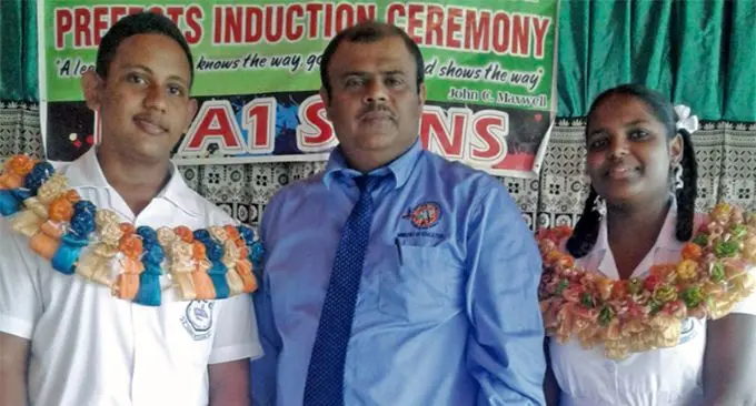 Nadogo Central College head boy Rosheel Chand with principal Mohammed Khan and head girl Priyashna Lal after the prefect induction at the school. 