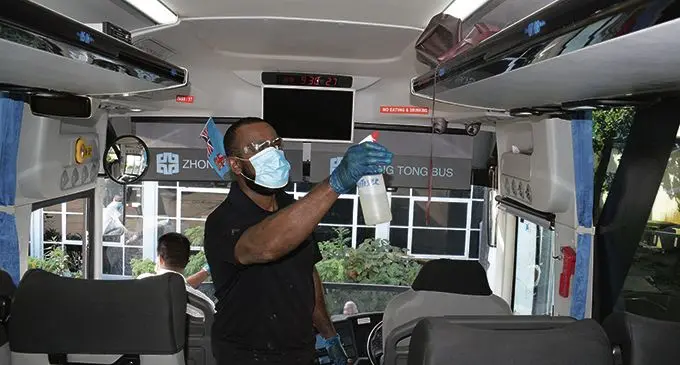 Pacific Transport staff, Mosese Salaba sanitises a bus at their Suva base on April 22, 2021. Photo: Ronald Kumar