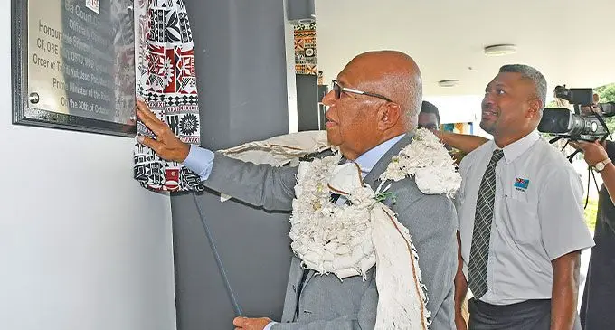 Prime Minister Sitiveni Rabuka unveils the plague at the official opening.