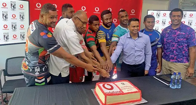 Fiji National Rugby League chairman Rear Admiral (Ret'd) Viliame Naupoto (second from left), Vodafone Fiji chief marketing officer Rajnesh Prasad {third from right), FNRL acting chief executive officer Dona Natabe (right) and team captains during the signing of the sponsorship renewal at the Vodafone headquarters on August 3, 2022: Photo: Sereana Salato
