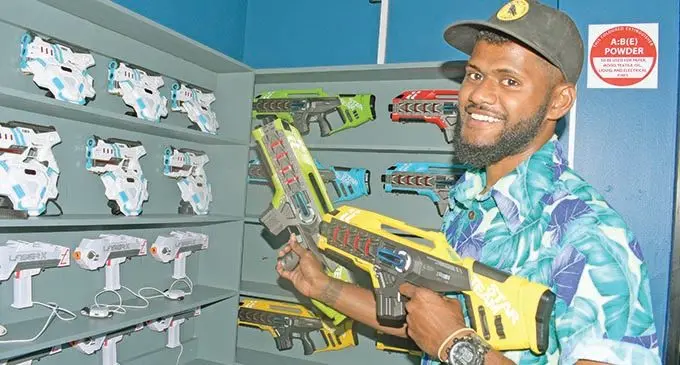 Battlefield Stun gaming assistant Jese Ligaiviu shows some of the instore games during the game shop opening at Sports City complex on December 1, 2020.   Photo: Ronald Kumar