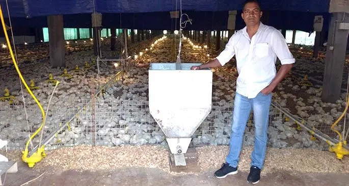Organic Valley business owner Salim Buksh at his broiler contract shed at Sarava, Ba