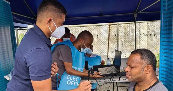 The Supervisor of Elections Mohammed Saneem helps out in the registration drive. Photo: Fijian Elections Office