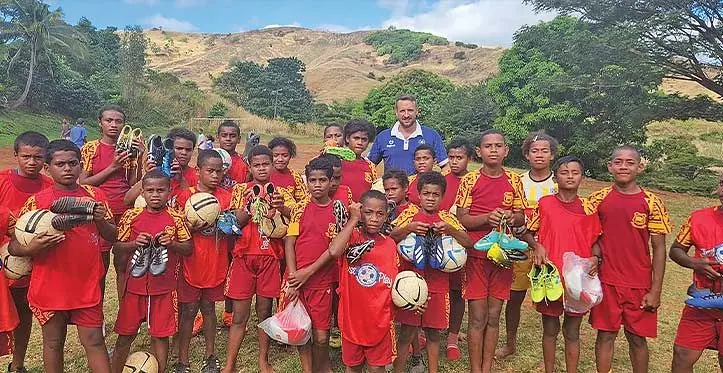 Fiji Football Association technical director Timo Jankowski with students of Teidamu Primary School in the interrior of Lautoka. Photo: Fiji FA Media