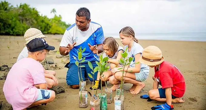 Young visitors being taught some local environmental activities. Photo: Fiji Hotel and Tourism Association