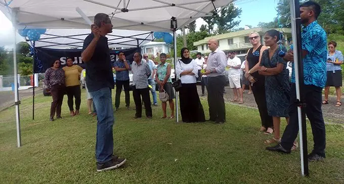 Harcourts owner, Shivas Singh (black T-shirt) speaking to the bidders in Simla, Lautoka.  Photo: Rohit Kumar