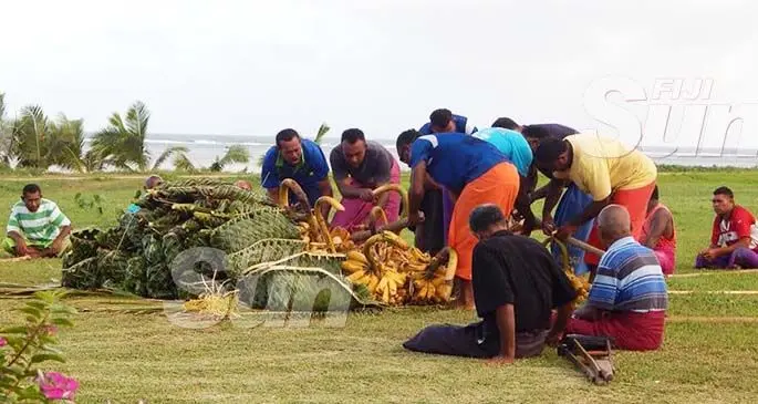 Villagers preparing the magiti before the presentation.