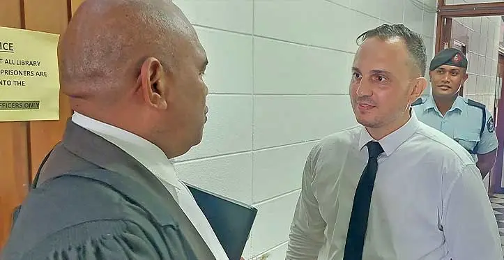 (Right) Joseph Abourizk speaks to his lawyer Mosese Naivalu at the High Court in Lautoka on April 12,2023. Photo. Salote Qalubau