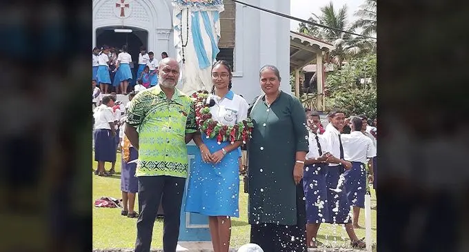 Lakshyaa Shankaran, with her parents Savitri Shankaran and Anil Shankaran after the prefect induction at Holy Cross College, Taveuni, on February 24, 2023.
