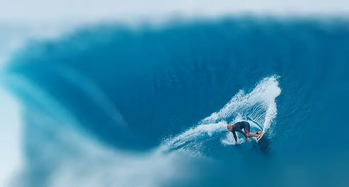 Kelly Slater tow surfing Cloudbreak Tavarua, Fiji.