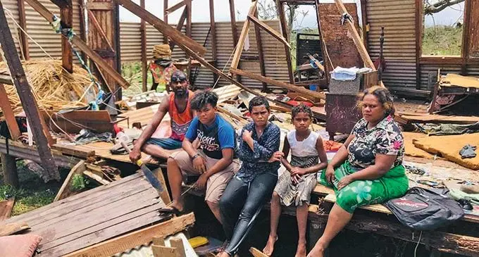 From left: Andrew Catanasiga with his children, Nunia Catanasiga, Nanise Catanasiga, Dilate Catanasiga and wife Mere  Catanasiga inside the remains of their house in Lekutu, Bua, after Cyclone Yasa on December 18, 2020.   Photo: Shratika Naidu