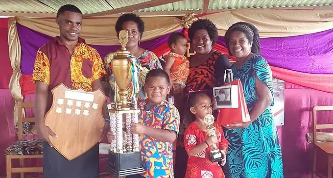 Uluivalili College dux Ilaisa Tabua (left), with family members at Uluivalili College in Cakaudrove on December 9, 2022.