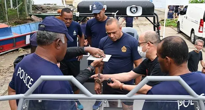 Police Commissioner Brigadier-General Sitiveni Qiliho with Police officers being briefed on the use of the rigid inflatable boats in their  operations against drugs in the maritime divisions.