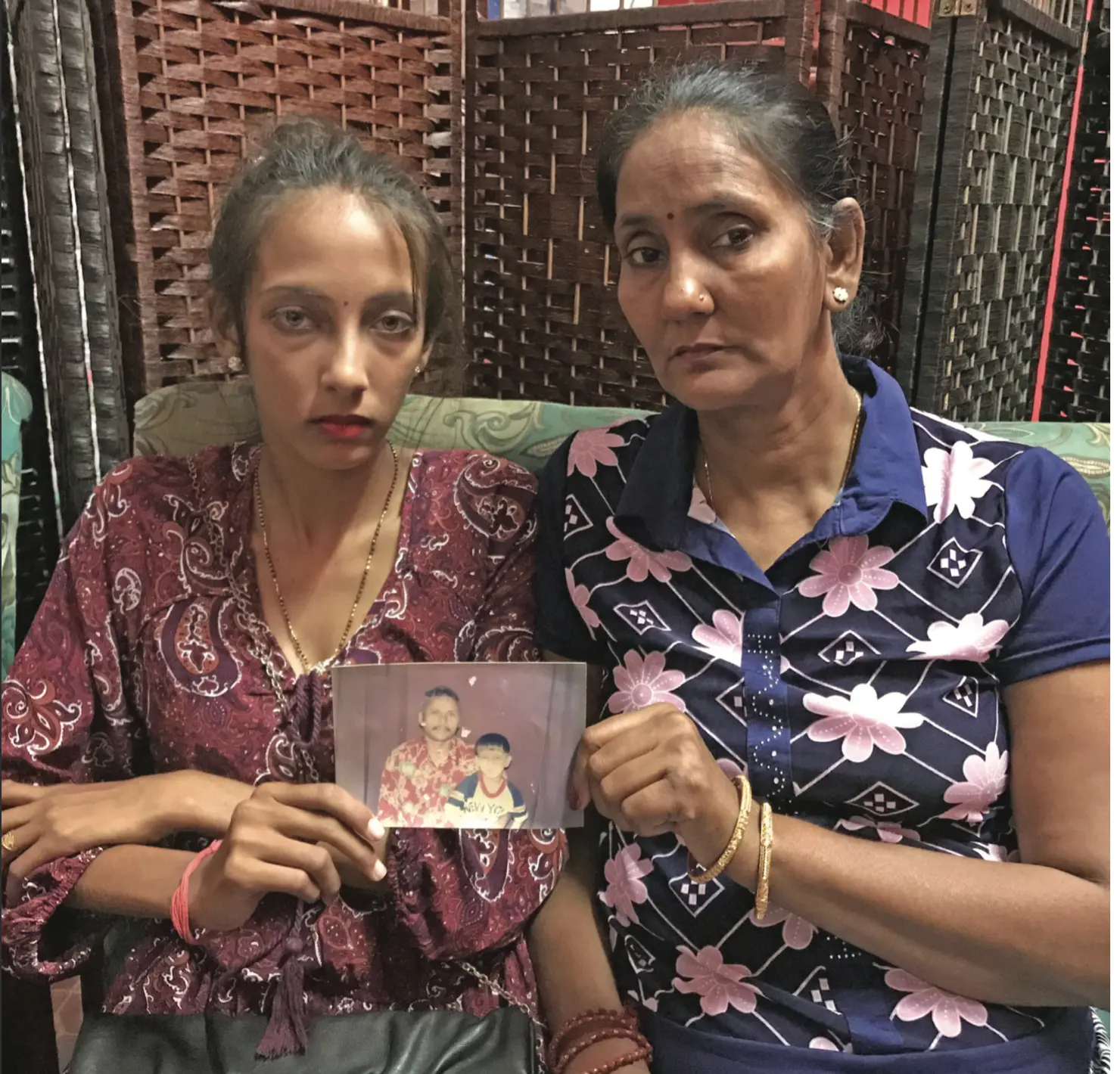 Chandra Wati (right) with her daughter Pooja Chand showing a photo of the family’s happier days in Labasa on March 14, 2019. Photo: Shratika Naidu