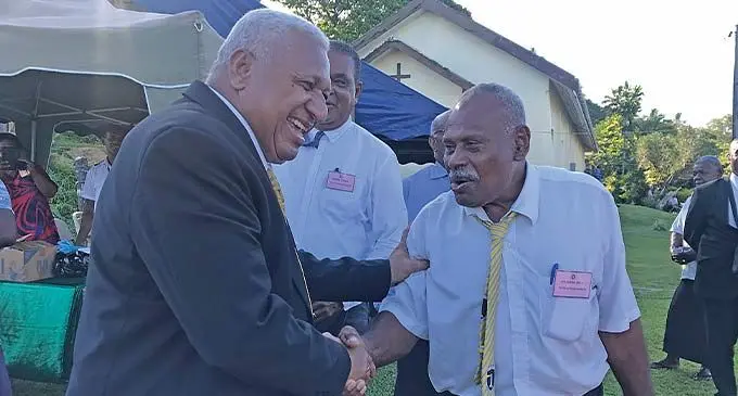 Prime Minister Voreqe Bainimarama with Buretu district representative Atunaisa Loco after the opening of the Tailevu Provincial Meeting at Naisausau Village in Namara on November 24, 2022. Photo: Lusiana Tuimaisala