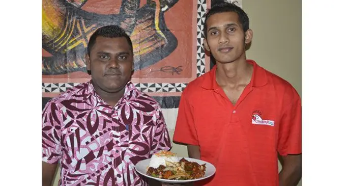 Manager and senior chef Ashneel Nair (left), and chef Babu Umlesh with a plate of Chicken Paprika at the restaurant in Nadi yesterday. Photo: Waisea Nasokia