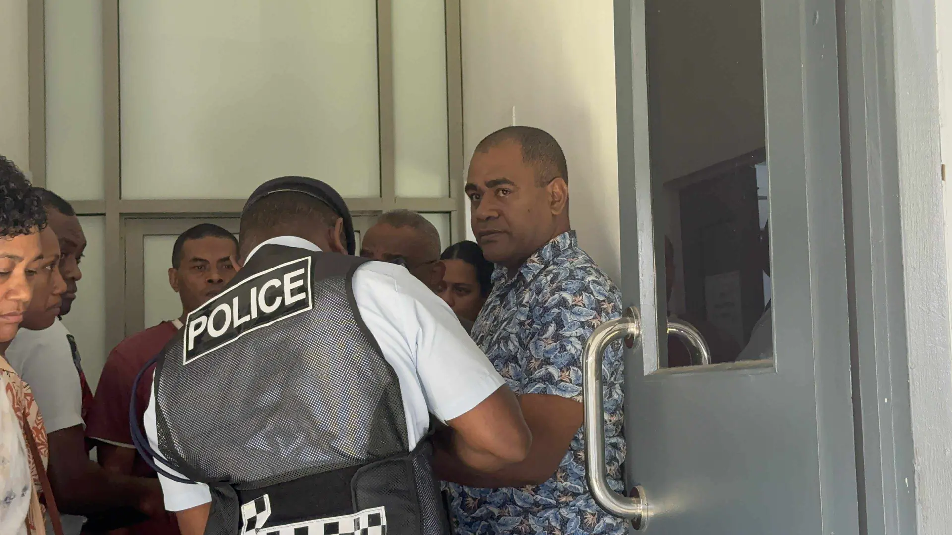 Police officer Isireli Daulevu outside the Suva Magistrate Court on October 1, 2025.