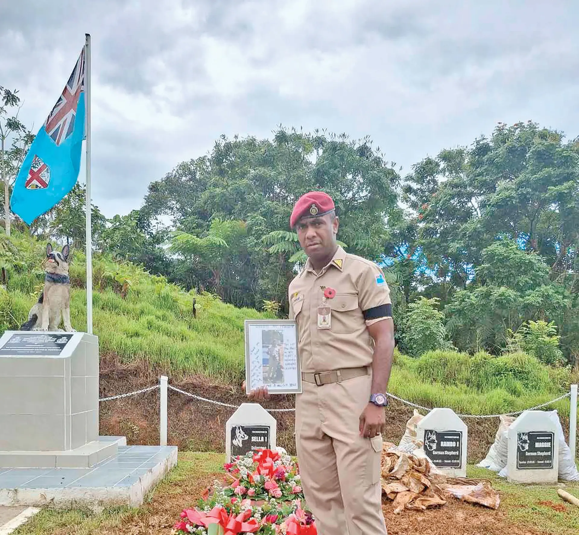 K9 Richie (left photo), with handler Class A officer Nikolau Luveicei. 