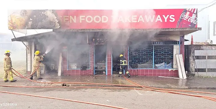 National Fire Authority firefighters at the scene on April 6, 2025.