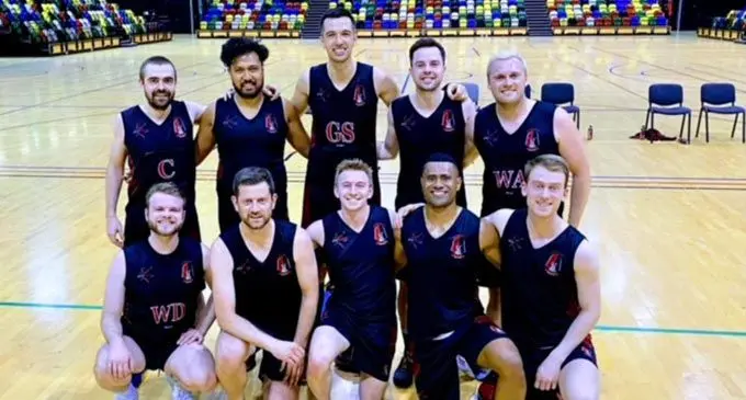 Kneeling fourth from left, David Sunaki, with his team.