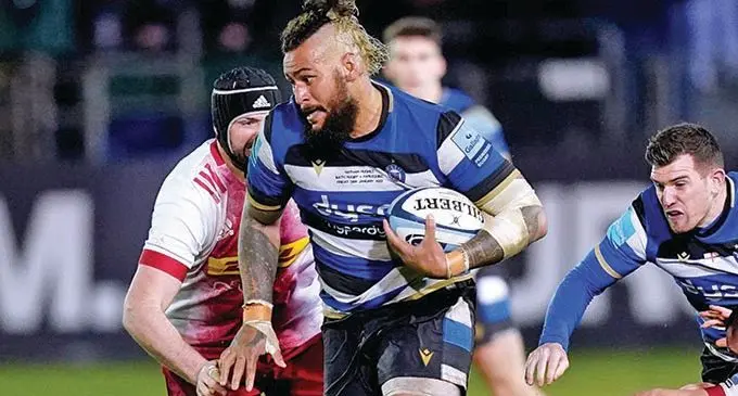 Bath forward Nathan Hughes (with ball) runs into a Harlequins opponent during their Round 14 match at the Recreation Ground, in Bath on January 29, 2022. Photo: Premiership Rugby