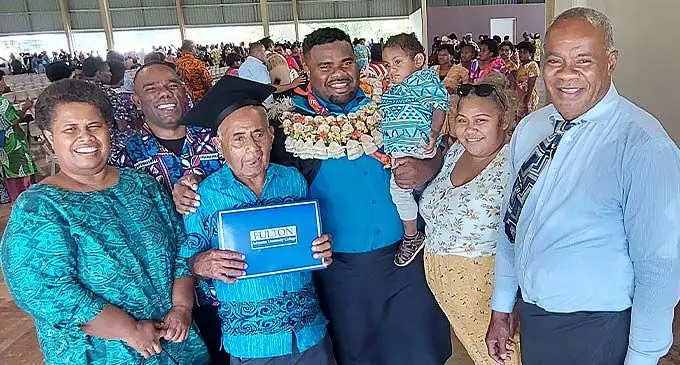 Clement Victor (garlanded), with his family after the graduation ceremony at Fulton Adventist University College in Sabeto, Nadi, on November 27, 2022. Photo: Salote Qalubau