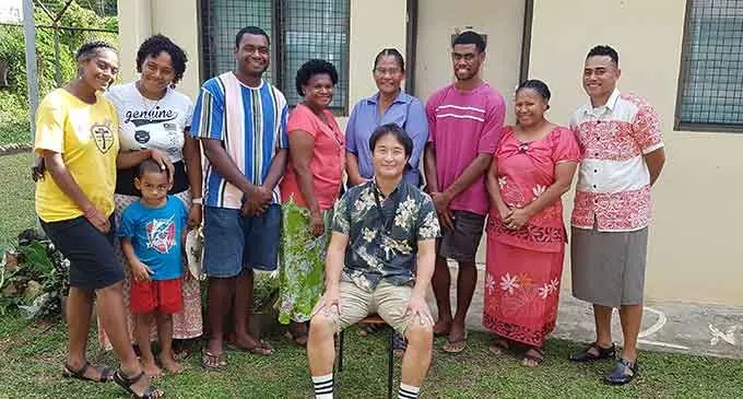 Anakeleto Tawake (standing third from right) with his mum, Gloriyah Tehillah (standing fourth from right) and the Free Bird Institute CEO, Hiroshi Taniguchi (sitting, front) with other students, their parents and teachers at the institute’s Lautoka Campus on July 13, 2022. Photo: Nicolette Chambers