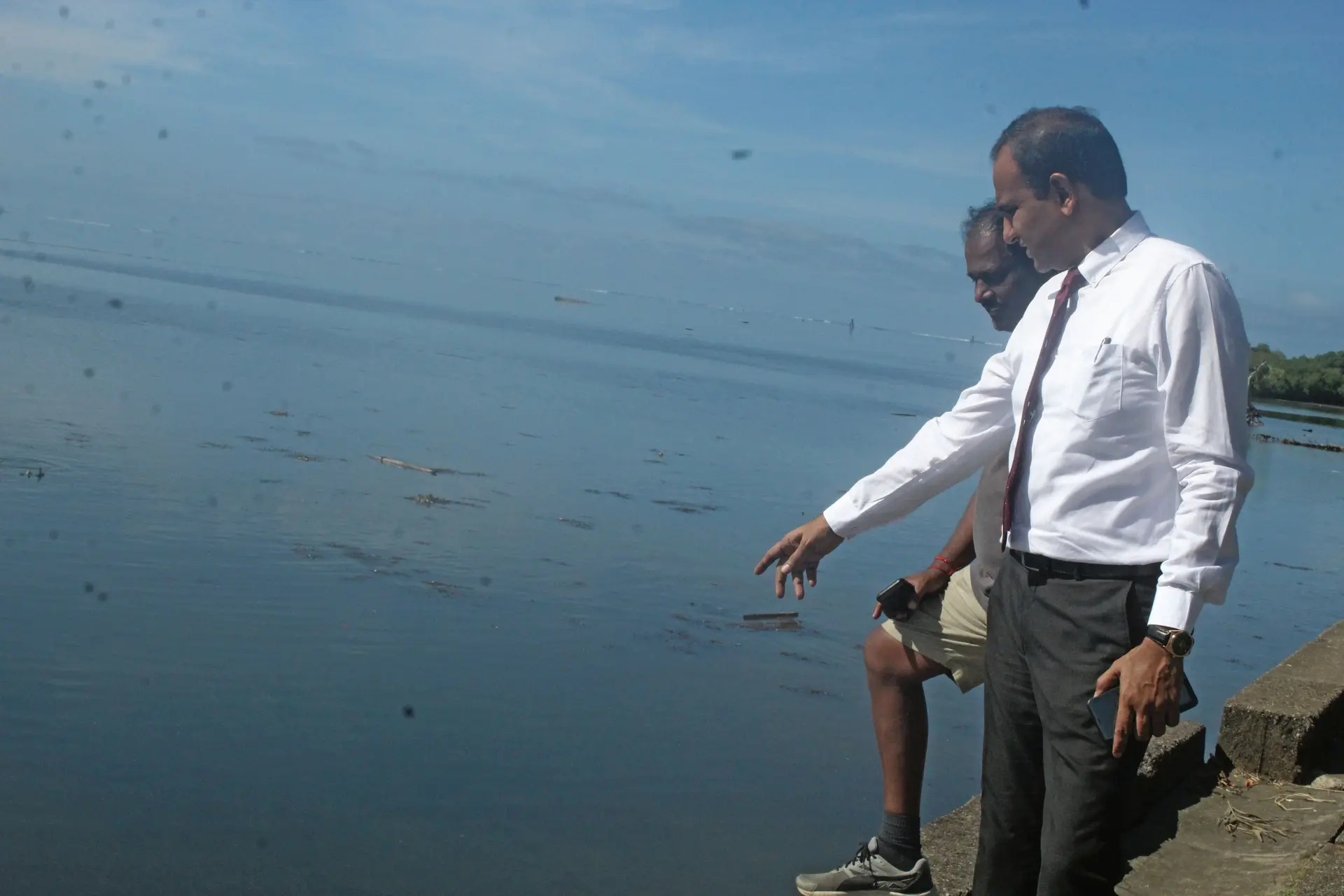 Permanent Secretary for the Ministry of Environment Joshua Wycliffe at the scene where the dead fish were found along Queen Elizabeth Drive on February 13, 2019.