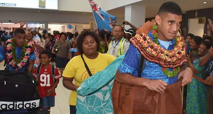 Fiji Airways Fijian 7s forward Meli Derenalagi is wrapped in masi as they arrive at Nadi International Airport on June 5, 2019.  Photo: Waisea Nasokia