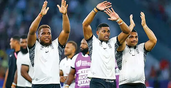 From left: Fiji’s Tevita Ikanivere, Ilaisa Droasese and Samuel Matavesi celebrate after the match against the Wallabies at Stade Geoffroy-Guichard in Saint-Etienne, France, on September 17, 2023. Photo: Reuters