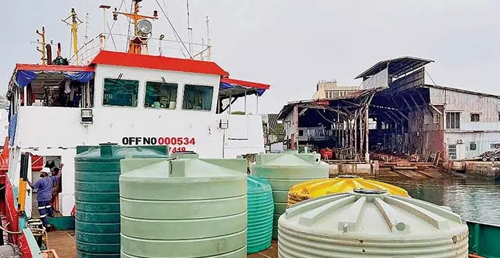 Water tanks being loaded onto a ship. Photo: DEPTFO