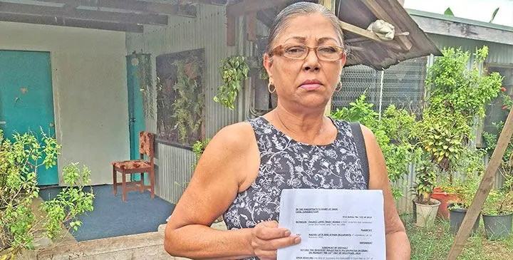 Madhu Lata, with her court order given by the TLTB staff at her home in Korovuto, Nadi.