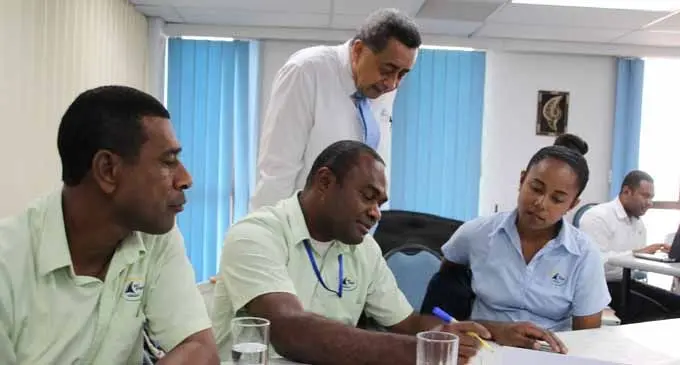 MSAF Manager Safety, Compliance and Response, Captain Philip Hill (standing) attends to a group discussion with Fiji Ports Corporation Limited’s Local Wharf Coordinator Necani Vorakitaki, (sitting left) Senior Ports Security Officer Neumi Radobui and Local Wharf Assistant Laisani Tagilala at the Oil Spill Workshop on February 20, 2018. Photo: Fiji Ports Corporation Limited