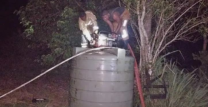 Firefighters had to use a pump to gather water from a water tank to put out a fire.