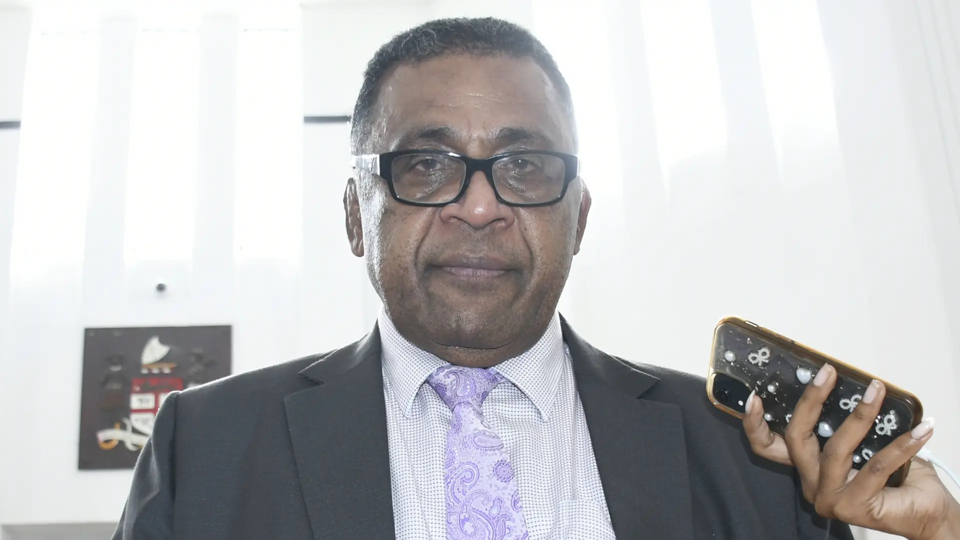 Minister for Finance, Commerce and Business Development Esrom Immanuel outside Parliament on  May 25, 2026.  Photo: Ronald Kum