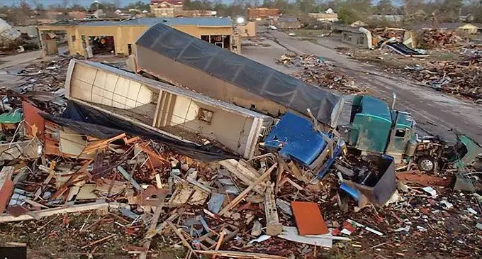 Trucks piled on buildings as tornado hits Mississippi. Photo: BBC News