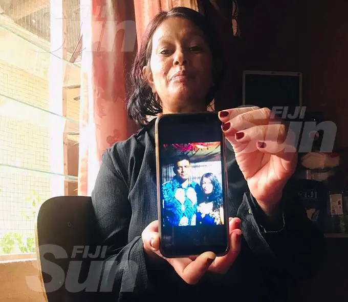 Jayant Shobna holds up the last photo she took with her husband, the late Chandar Prakash Reddy. Photo: Salote Qalubau