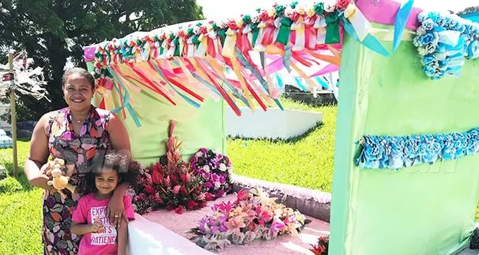 Daughter of the late former Speaker of Parliament Fatafehi Luveni with little Jiko Luveni at Dr Luveni’s grave on February 22, 2020. Photo: Inoke Rabonu