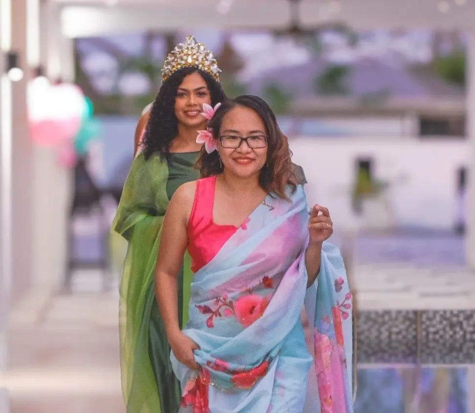 Event founder Cynthia Cebujano (front), with Seema Ram on the catwalk with some designs. 