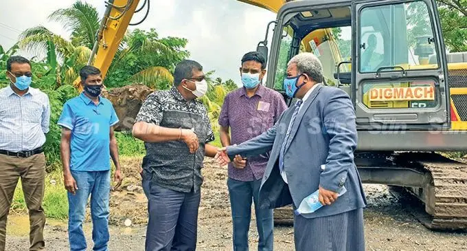 The Minister for Waterways, Environment and Agriculture, Mahendra Reddy (second from left) meeting with Member of Parliament, Jese Saukuru (first from right) before commissioning the de-silting works project at Vitogo Village in Lautoka on February 3, 2022. Photo: Nicolette Chambers