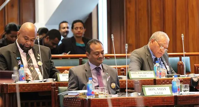 From left: Government backbenchers Howard Politini, Assistant Minister for Infrastructure and Transport Vijay Nath and Netani Rika in Parliament on March 8, 2018.  Photo: Parliament of Fiji