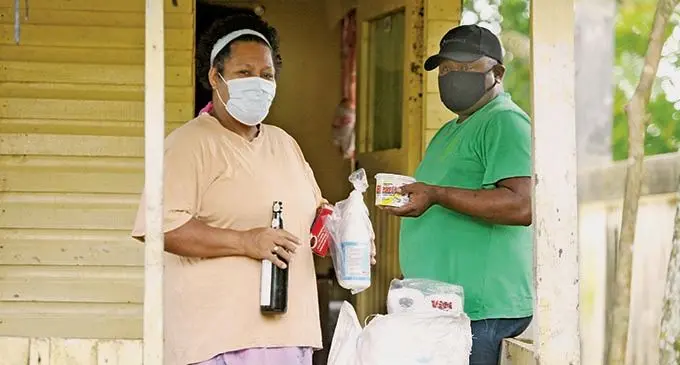 Maria with her husband, Osea Kuruduadua after receiving Government food ration at the Kuruduadua family is in isolation at their Nepani home on January 12, 2021. Photo: Ronald Kumar.