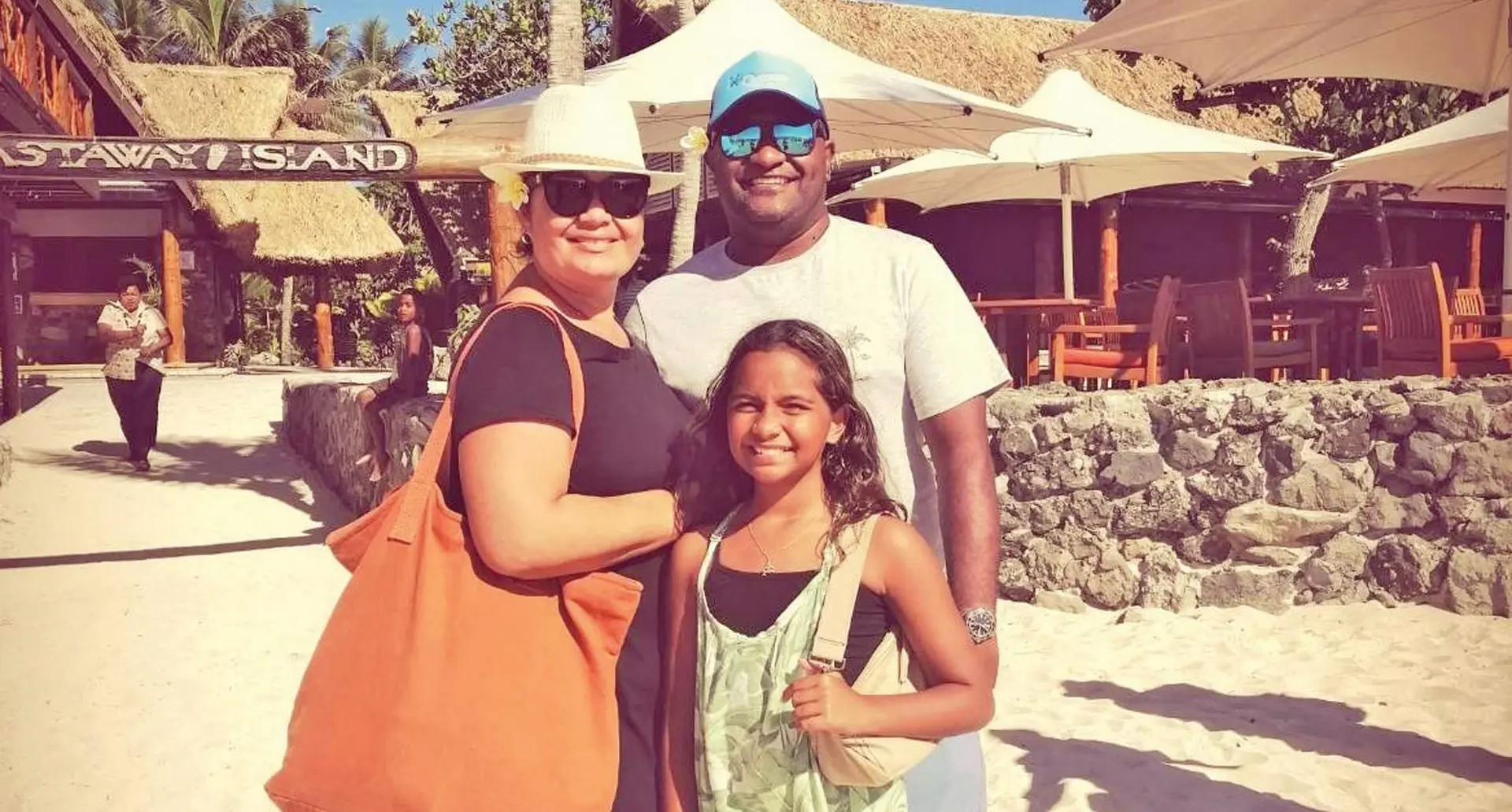 Eminoni Wivou (right), with his wife Jocelyn and daughter Niconia, at Castaway Island Resort. 