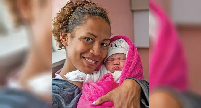 Temalesi Vuaniququ holding up her newborn daughter Miliakere Ledua Aditaroga who was born during the Easter weekend on April 9 2023. Photo: Leon Lord