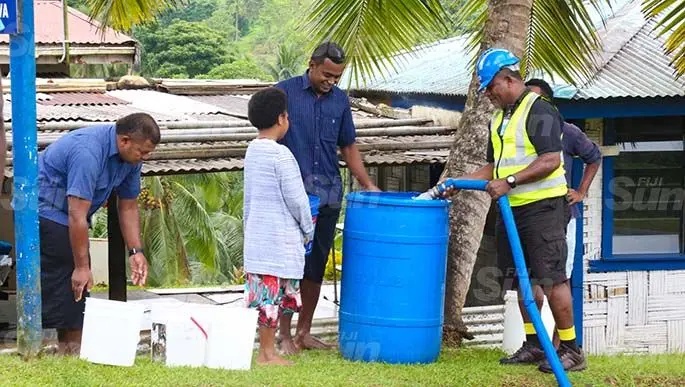 Residents of Wailoku have their drums and buckets filled by water carting trucks provided by the Water Authority of Fiji on April 24, 2020. Photo: Kelera Sovasiga