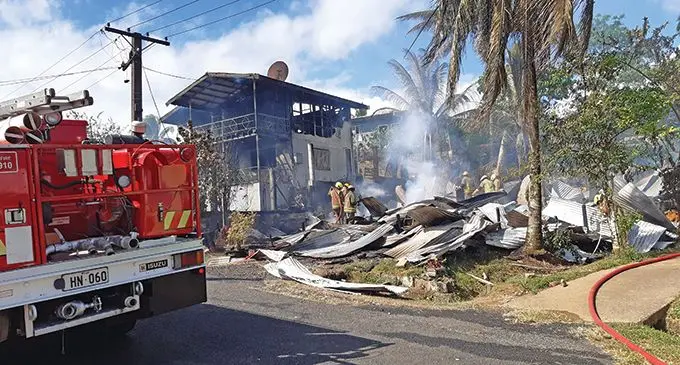 Firefighters at the scene. The fire at Kavika Place in Nakasi that destroyed two homes.  Photo: Shalveen Chand